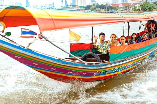 A longtail boat carrying passengers on the Chao Phraya River