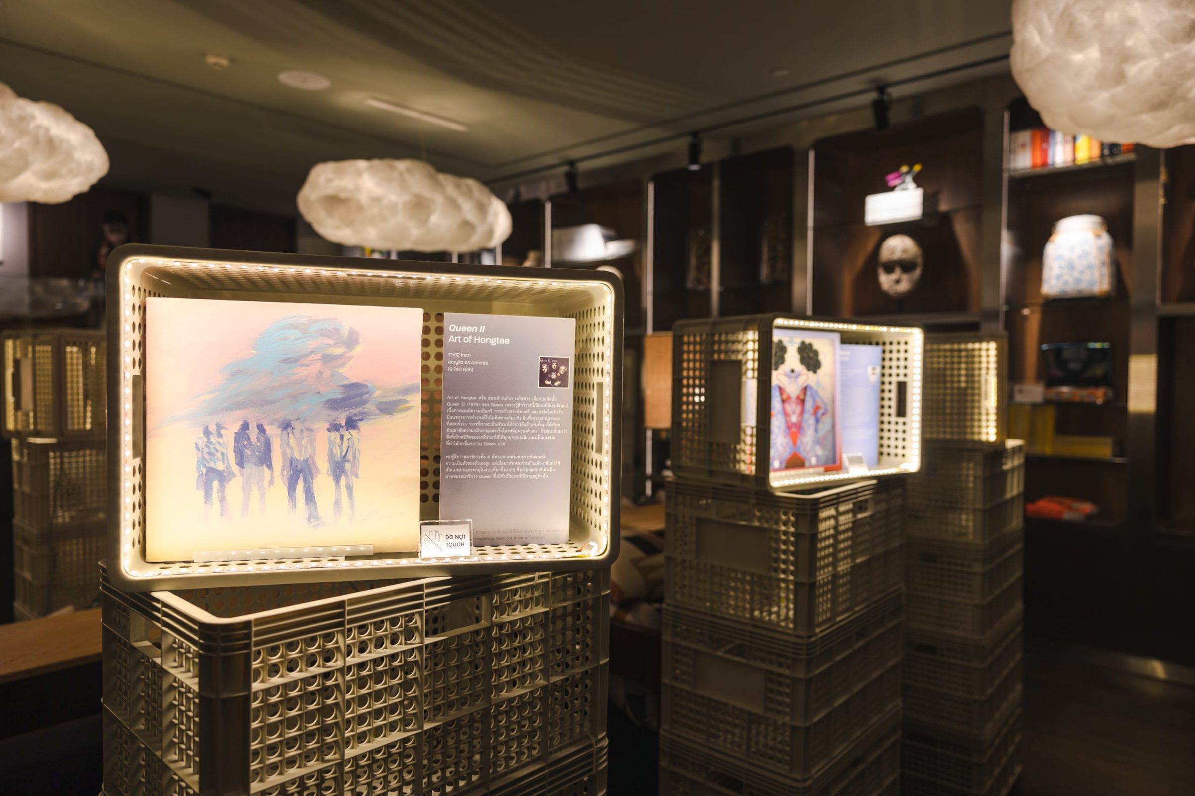 Lit display vitrines in the lobby at Public House Bangkok