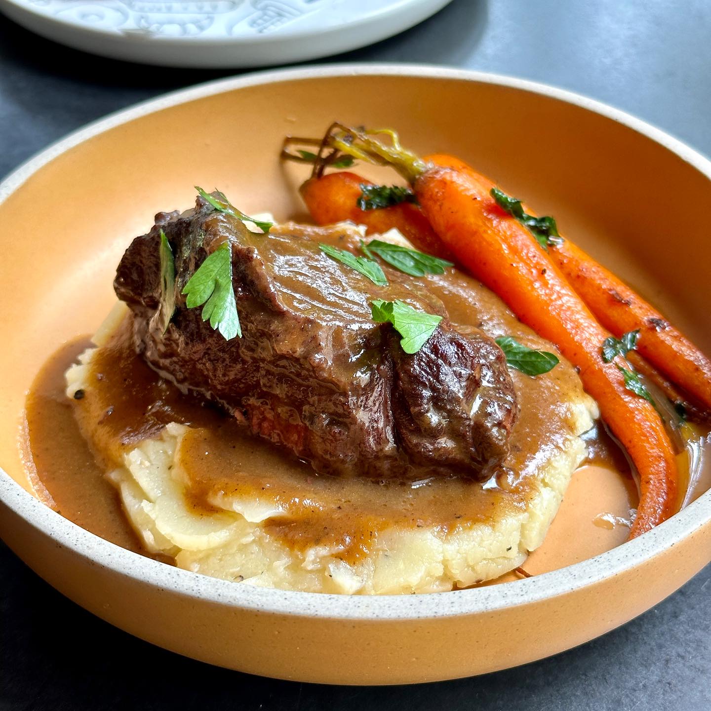 Braised beef with glazed carrots and mashed potato