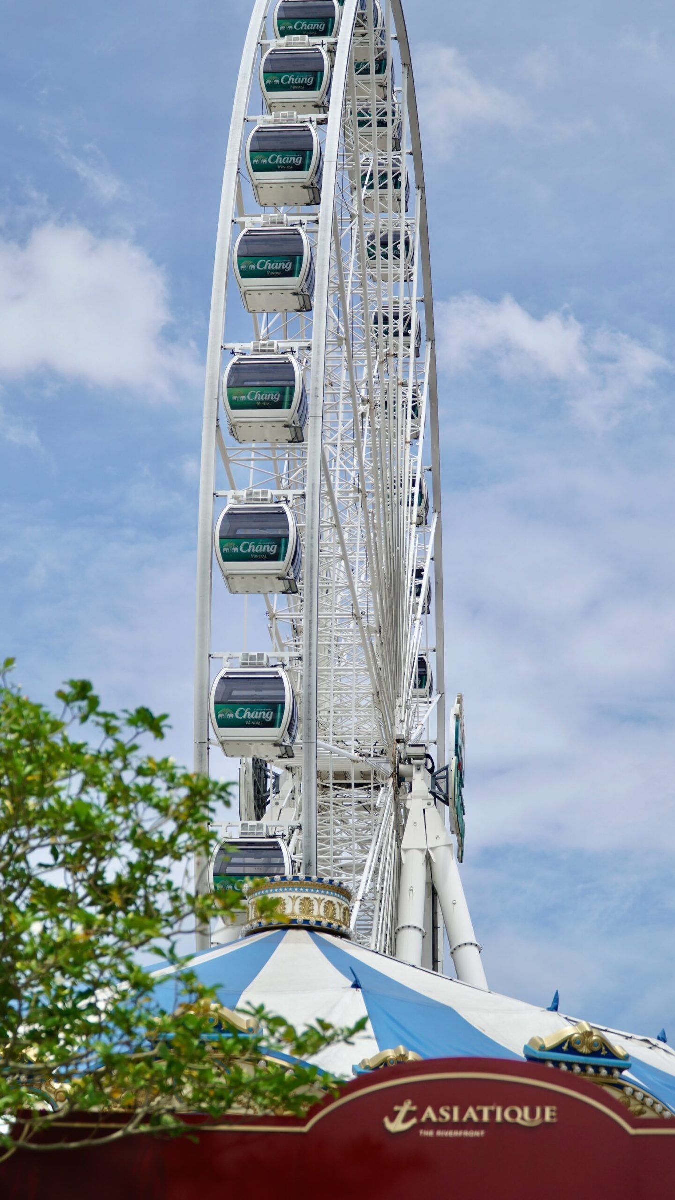 The Bangkok Eye ferris wheel seen above the treetops