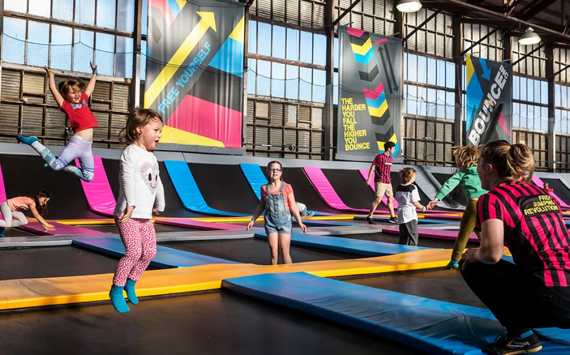 Children jumping on the trampolines of a Bangkok indoor trampoline park