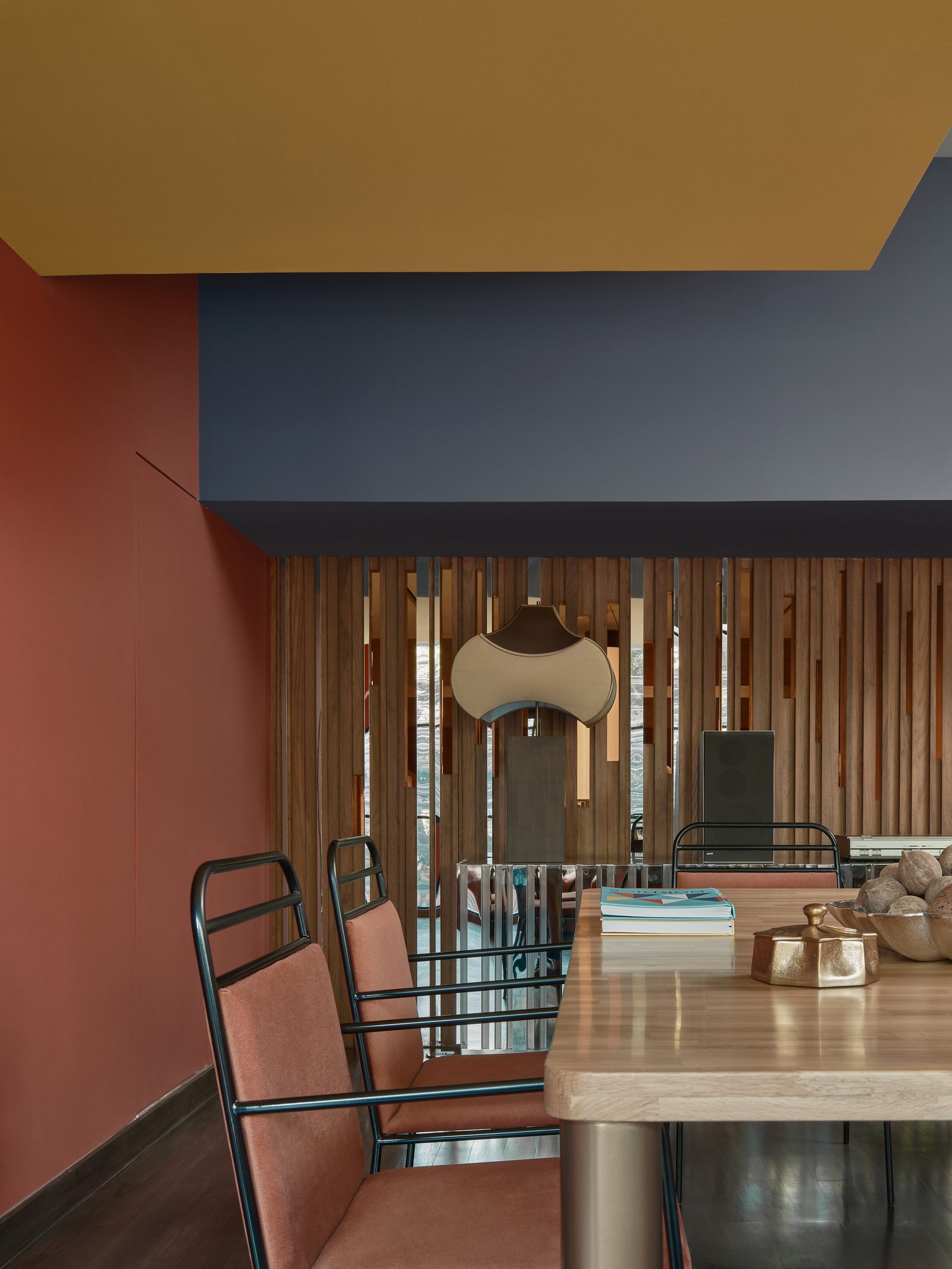 The FLEXI-ROOM at Public House Bangkok, laid out for a private event under a mustard and navy soffit against a terracotta wall