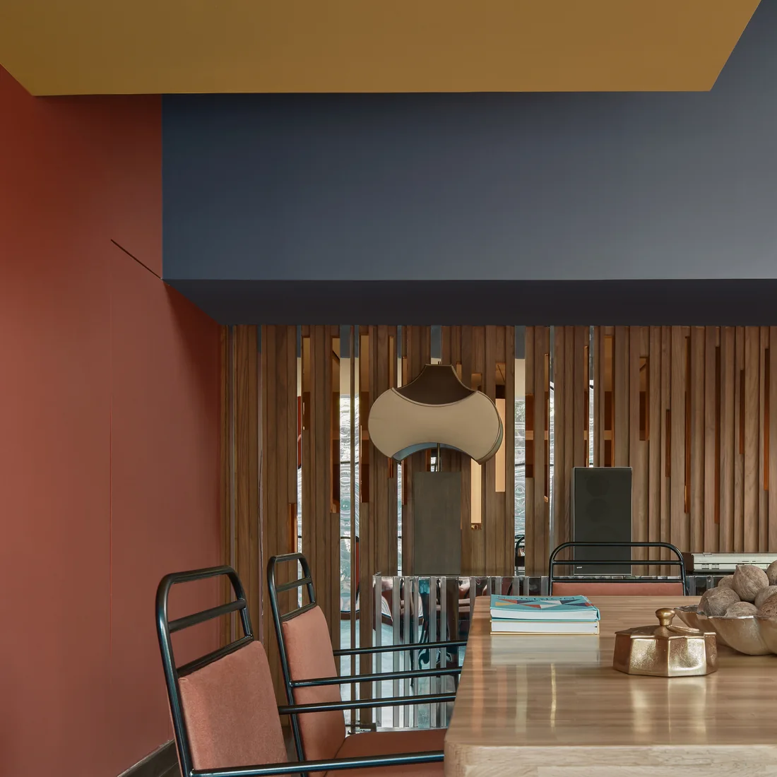 The FLEXI-ROOM at Public House Bangkok, under a mustard and navy soffit against a terracotta wall